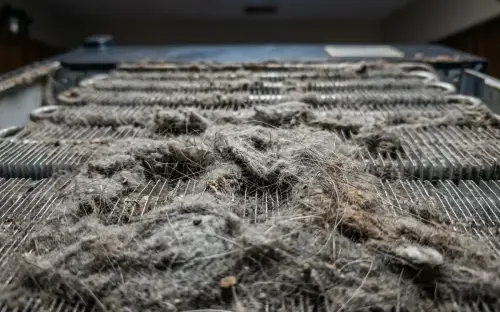 Sub-Zero PRO 48 Overhead Condenser Coil Heavily Clogged with Lint and Dust Before Service