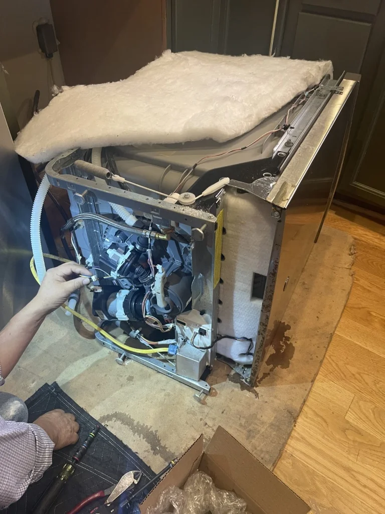 Master Certified Appliance Technician Inspecting Cove Dishwasher Anti-Siphon Loop and Wiring Harness