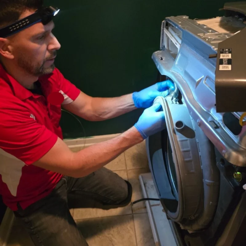 Technician headlamp inspection of washing machine internal tub seal assembly