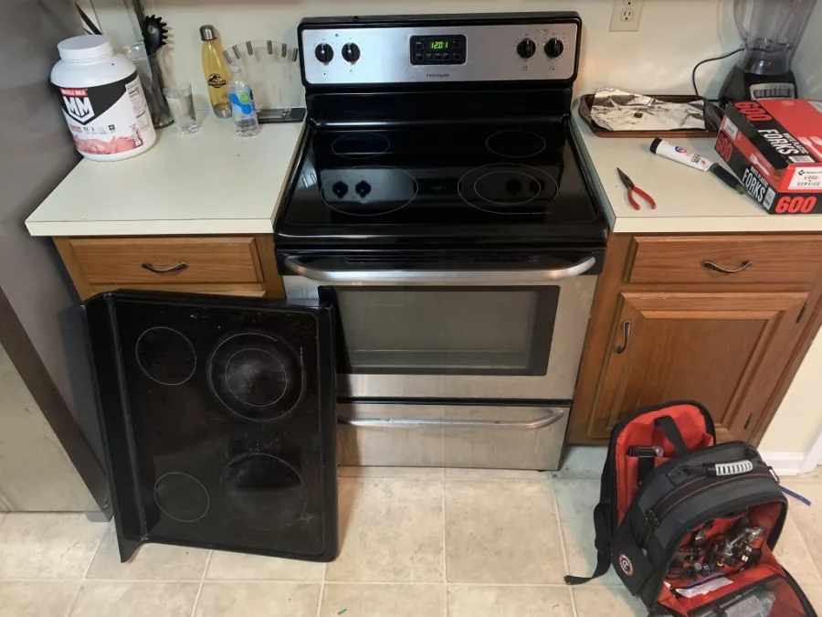 Frigidaire electric range ceramic glass cooktop replacement and technician tool bag in Alpharetta GA kitchen