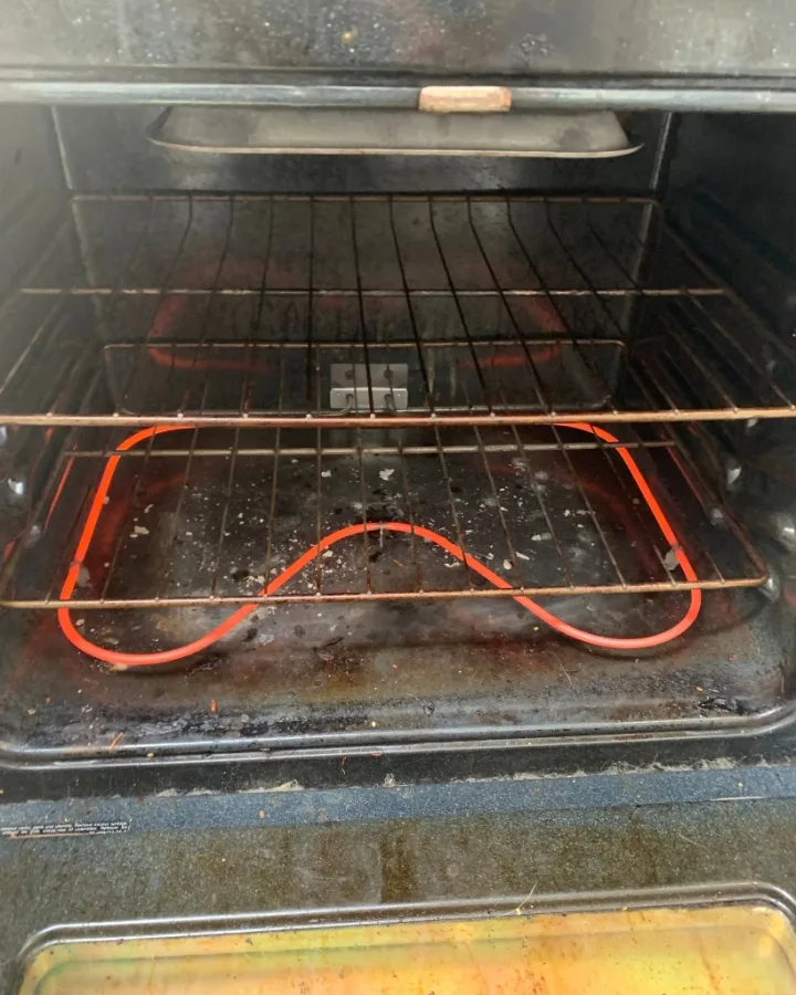 Electric oven bake element glowing bright red hot operational test in Alpharetta