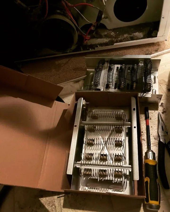 Electric dryer heating element replacement showing new OEM coil in box versus burned element in Alpharetta